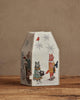 The Coral & Tusk Snow Day Tissue Box Cover features a house-shaped design with embroidered animals in winter attire, snowflakes, and a red bird on beige fabric—an adorable accent for your seasonal decor.