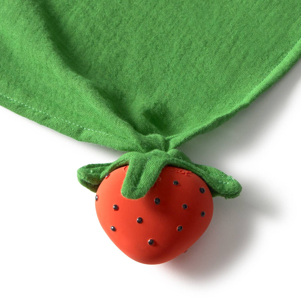 Sweetie the Strawberry Big Doudou is an organic cotton baby comforter featuring a red strawberry shape with black dots and green fabric leaves, designed for gentle teething relief and cuddly comfort.