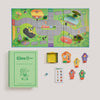 The Clue Jr. Vintage Bookshelf Edition includes a vintage-style green storage box, a folded game board with a suburban neighborhood map, four character playing pieces, a die, and a deck of cards.