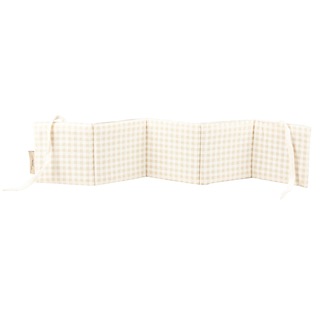 The Little Farm Soft Book, shown folded in a zigzag shape against a white background, features a beige and white checkered design with ties at both ends. Perfect as a baby gift.