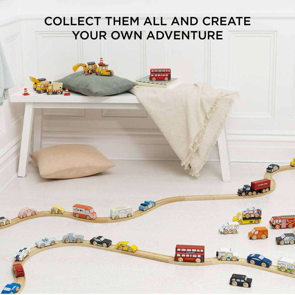 The London Toy Car Set features classic vehicles arranged on a train track in a cozy, bright room. Text reads: "COLLECT THEM ALL AND CREATE YOUR OWN ADVENTURE.