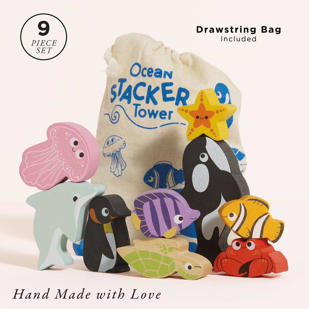 Nine colorful wooden ocean animal toys—including a shark, jellyfish, orca, starfish, crab, fish, and penguin—are displayed with the "Ocean Life Stacking Animals & Bag," making them perfect for sensory play and stacking fun.