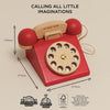 The Vintage Wooden Telephone is a red and natural retro toy phone made from sustainable wood, featuring white number holes. FSC certified, plastic-free, and eco-friendly, it measures 190mm tall by 255mm wide/deep—perfect for charming, conscious play.