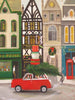 In the Christmas Cheer - 1000 Piece Jigsaw Puzzle, a red car carrying a Christmas tree on its roof drives past a street of shops decorated for the holidays.