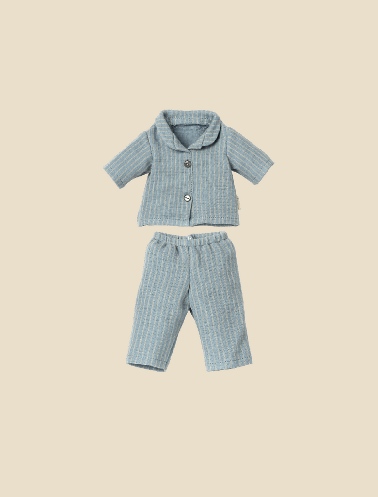 Introducing the Maileg Extra Clothing: Pyjama for Teddy Dad, a delightful doll ensemble that features a light blue short-sleeve button-up shirt paired with matching pants, all adorned with a subtle gray striped pattern. Displayed on a simple beige background, this charming outfit is available for purchase separately.