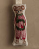 Coral & Tusk Mouse with Wreath Ornament: An embroidered mouse in red striped pajamas and green scarf, holding an evergreen wreath with a red bird, set against a neutral background.