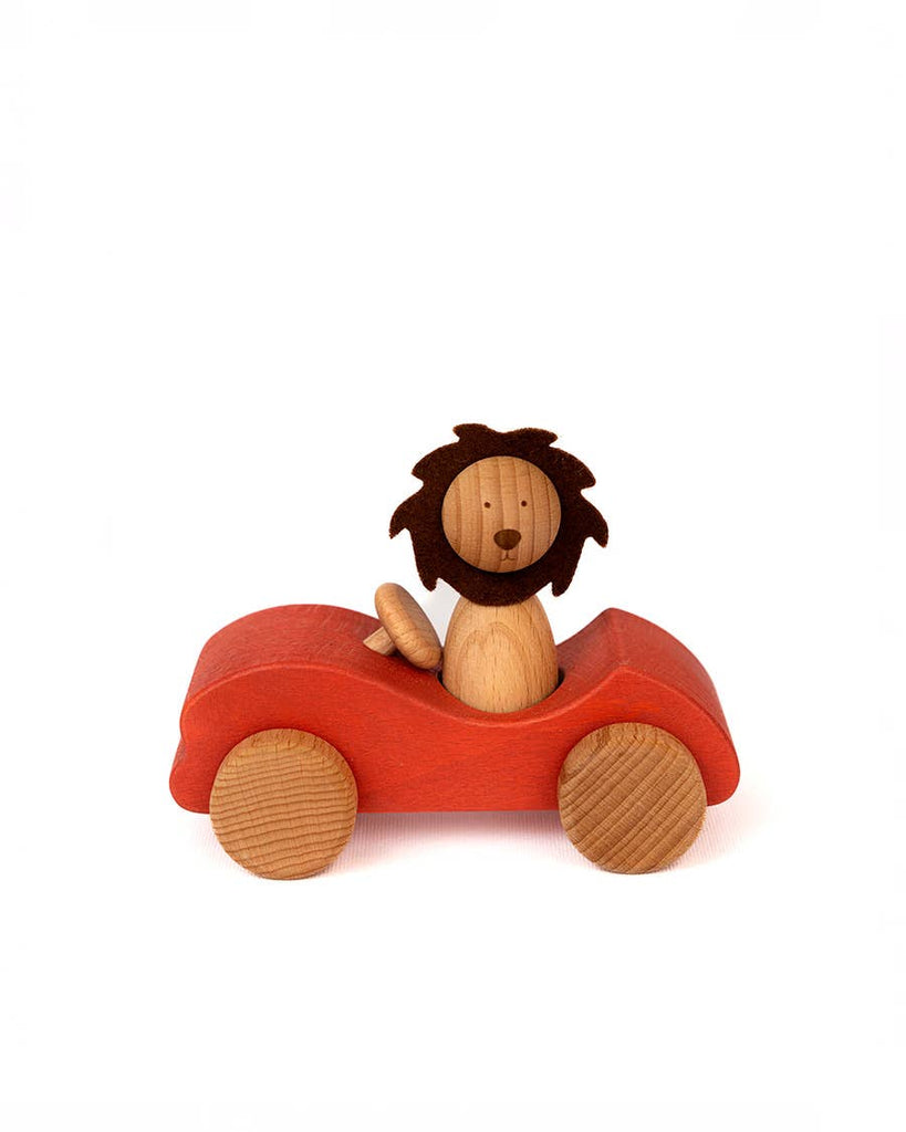 The Sabo Concept Car with Lion features a wooden lion with a dark mane riding in a small red car, both with simple, rounded shapes—ideal for imaginative play—set against a plain white background.
