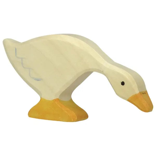 A handcrafted wood toy, this wooden goose figurine is painted in light cream and yellow colors. Made in Europe, the Holztiger Goose, Feeding figure depicts a goose with its head lowered and neck extended, as if pecking at something. It has simple black eyes and minimal detailing on its body.