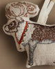 The Coral & Tusk Reindeer with Bells Ornament is a fabric holiday reindeer, embroidered in brown and white with a red collar, golden bells, and a cream hanging loop.