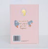The back cover of the pink hardcover Emma Collector's Edition displays a gold cameo silhouette, the quote "You must be the best judge of your own happiness," decorative berry leaves, and a barcode on the lower left side.