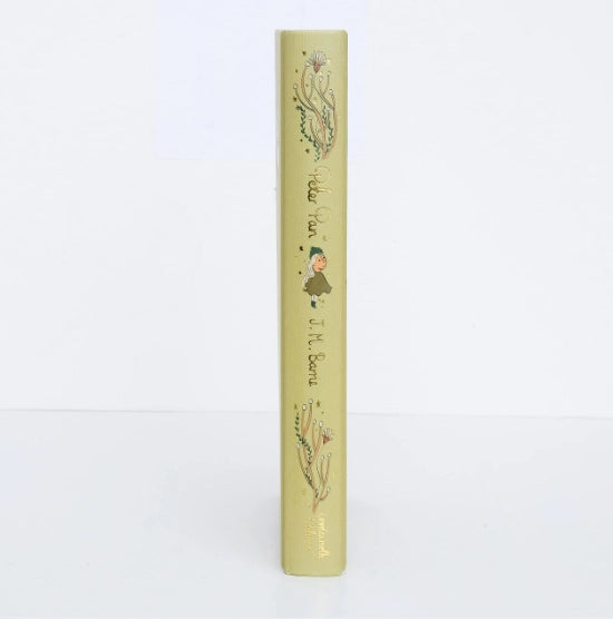 The light yellow spine of the "Peter Pan | Barrie | Collector's Edition | Hardcover Book" features charming illustrations like Captain Hook and decorative flowers, making it a treasured piece for any literary enthusiast.