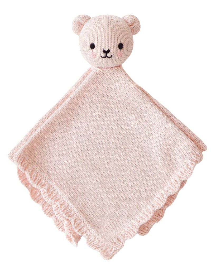 The Cuddle + Kind Organic Cotton Baby Bear Lovey (Blush) is a soft, hand-knit, light pink blanket featuring a cute bear head and ruffled edges—making it an adorable fair trade gift for babies.
