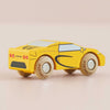 A small yellow No. 19 GT105 Louis classic toy car with black details and “LE TOY VAN” printed on the wheels sits on a light pink surface.