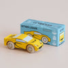A yellow wooden sports car sits beside its blue box labeled “No. 19 GT105 Louis | Made in England.” The box features an illustration of the classic toy car and text indicating it is a limited edition by Le Toy Van.
