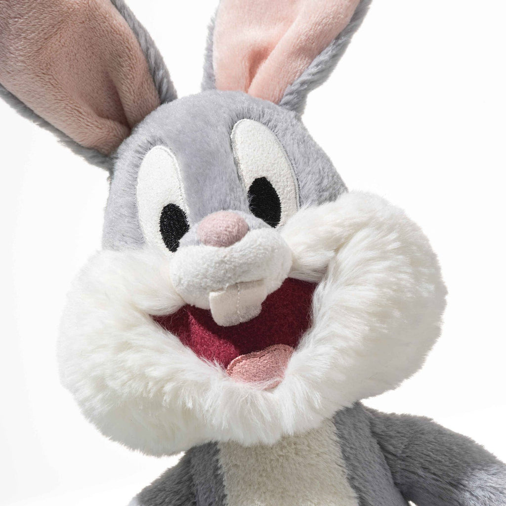A close-up of the Steiff Looney Tunes Bugs Bunny plush—a gray and white rabbit with big ears, large eyes, fluffy cheeks, and an open mouth with two front teeth—ideal for any Looney Tunes collectible fan.
