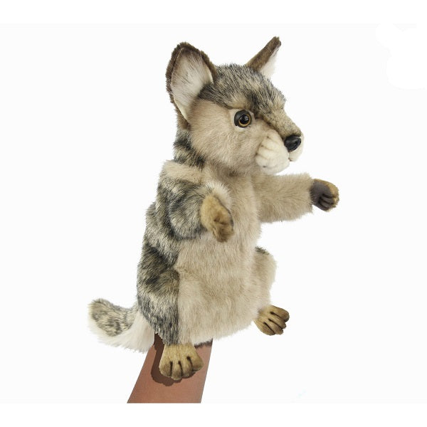 A realistic Wolf Puppet with tan, gray, and white fur is shown upright on a person's hand against a plain white background.