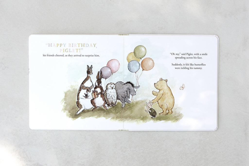 Illustration from Winnie-the-Pooh: Finding Feelings board book, featuring Piglet, Pooh, Eeyore, Kanga, Roo, Owl & Rabbit with balloons—ideal for helping toddlers explore emotions through storybook charm.