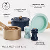 Pots & Pans Kitchen Accessories seven-piece wooden toy set, including a lidded pot, a pan, a wooden spoon, and salt and pepper shakers.