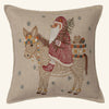 The Christmas Donkey Pillow features an embroidered donkey holding a Christmas tree with a toy basket holding a teddy bear. Snowflake patterns stitched around them complete the festive holiday décor.