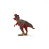 A Schleich Red Tyrannosaurus Rex Dinosaur Toy stands on a white background, predominantly brown with red accents, facing away to display its tail and back.