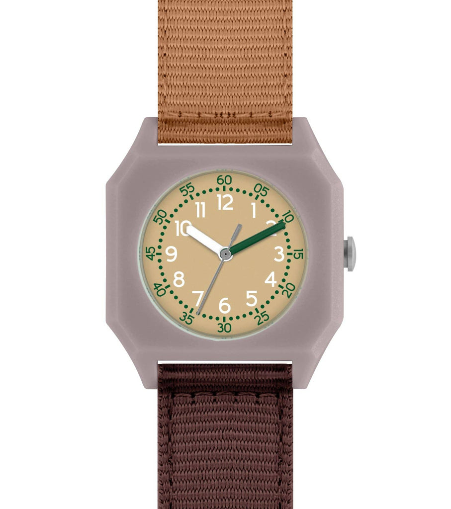 The Mini Kyomo Watch - Plum Cake features a square face, tan dial, white numbers, green second markers, brown and dark green hands, beige second hand, and brown/tan fabric straps.