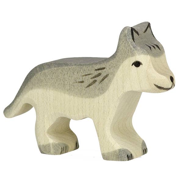 The Holztiger Wolf, Small is a handcrafted wooden figurine painted in light and dark gray tones, featuring simple carved details for fur, eyes, and nose. Like all HOLZTIGER figures, it is made in Europe with a focus on artistry and quality to inspire imaginative play.