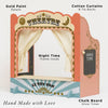 The Tabletop Puppet Wooden Theater by LE TOY VAN features gold detailing, cotton curtains, a “Theatre” sign, a chalkboard for show times, and a nighttime interior theme. Perfect for imaginative play and handmade with love.
