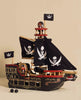 The Barbarossa Pirate Ship & Characters (ships in one week) is an eco-friendly wooden pirate ship toy with black sails, white skull and crossbones, two pirate figures, cannonballs, and a nameplate—shown against a beige background.