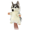 The Husky Dog Puppet features realistic gray and white fur, blue eyes, and a fluffy design. Shown on a hand against a white background.