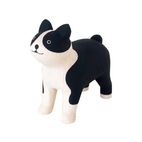 A handcrafted Boston Terrier wooden toy figure with an alert expression, standing isolated on a white background.