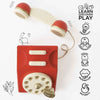 The Vintage Wooden Telephone is a red and cream toy phone featuring “Learn, Discover, Play” and icons for creativity, coordination, social skills, imagination, and dexterity on a white background with playful doodles.