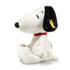 The Peanuts Snoopy Plush Toy features white fur, black ears, embroidered eyes, and a black nose. It sits upright and sports a red collar with a yellow tag on its left ear.