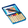 The Stockmar Wax Stick Crayons Tin Case - 8 Supplementary Colors includes eight non-toxic crayons, a scraper tool, and an illustrated booklet, all neatly arranged in a blue metal tin for convenient art education.
