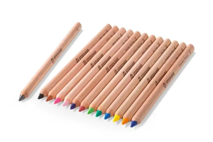 The Stockmar Triangular Colored Pencil Set includes 12 vibrant colors plus a graphite pencil, all FSC certified with natural wood exteriors—showcasing premium German craftsmanship on a white background.