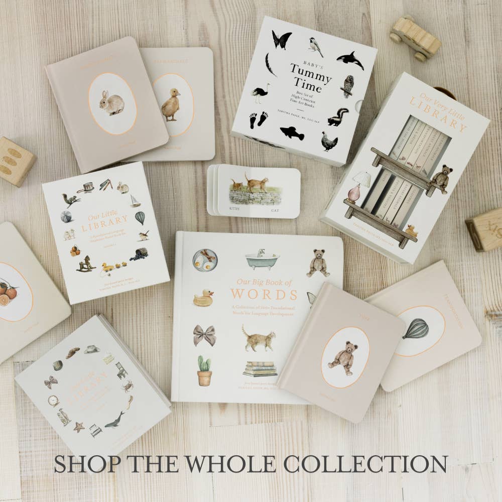 A flat lay of "Our Little Adventure at Christmas (Baby's first Christmas)"—an illustrated book with animal and nature themes for toddlers—arranged on a light wooden surface. Wooden letter blocks and "SHOP THE WHOLE COLLECTION" appear below.