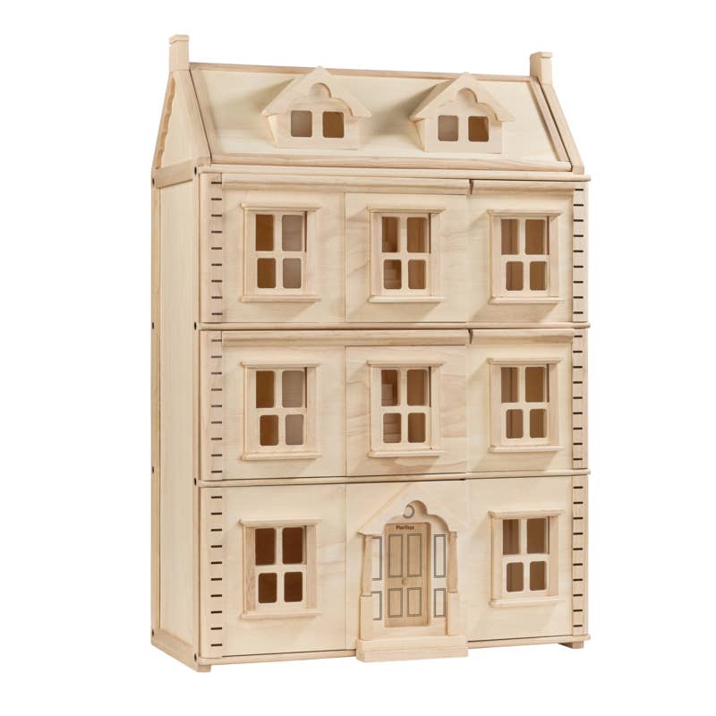 The Grand Victorian Dollhouse is a three-story wooden house with symmetrical windows, a central front door, unfinished natural wood, two dormer windows on the roof, and an attic—capturing the charm of a classic townhouse.