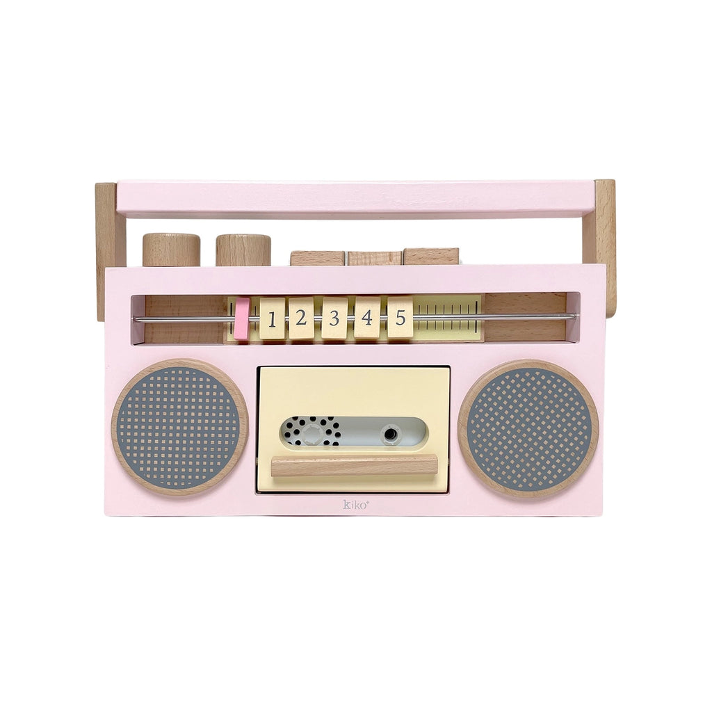 A pink and wooden children's toy Retro Wooden Tape Recorder with two circular speakers, playful knobs and dials, and a stylized design resembling an old school boombox.