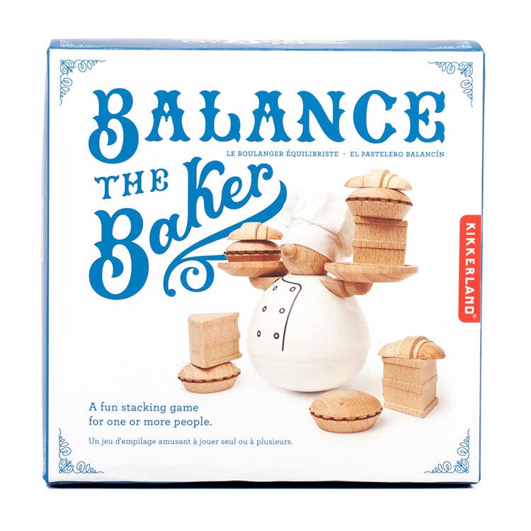 Box for the Balance the Baker Stacking Game showing a baker balancing wooden pastries. This fun stacking toy, suitable for one or more players, features the Kikkerland brand name on the right side.