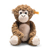 The Bodo Monkey Plush Stuffed Toy, 12 Inches, has a light beige face, belly, hands, and feet, large round eyes, a yellow tag in its left ear, and sits upright against a white background.