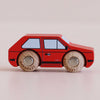 The No. 8 GT50 Gary | Made in England is a small red wooden toy car featuring black and blue detailing with classic wooden wheels, displayed on a light neutral background—its vintage appeal makes it perfect for both collectors and children.