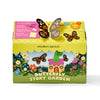 The Magical Minds Garden Kit is a plastic-free STEM DIY craft for ages 3+, featuring cartoon butterflies, flowers, and a mushroom house. It comes with a butterfly-shaped closure and lists contents in the top left corner.