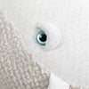 The image shows a close-up of BigStuffed's The Big Whale Albino stuffed animal, featuring a textured fabric surface with a cream and light gray color scheme. A large, bright blue eye surrounded by white hints at exciting ocean adventures.