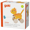 A box for the Holztiger Pull-Along Cat, an orange-striped, wooden cat toy with wheels and a bell, suitable for ages 1+. The packaging depicts the toy in use and includes multilingual text.