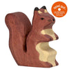 The Squirrel, brown is a handcrafted toy made from maple and beech wood, featuring an upright pose with a curled tail. An orange "spiel gut" quality recommendation badge appears in the top right corner.