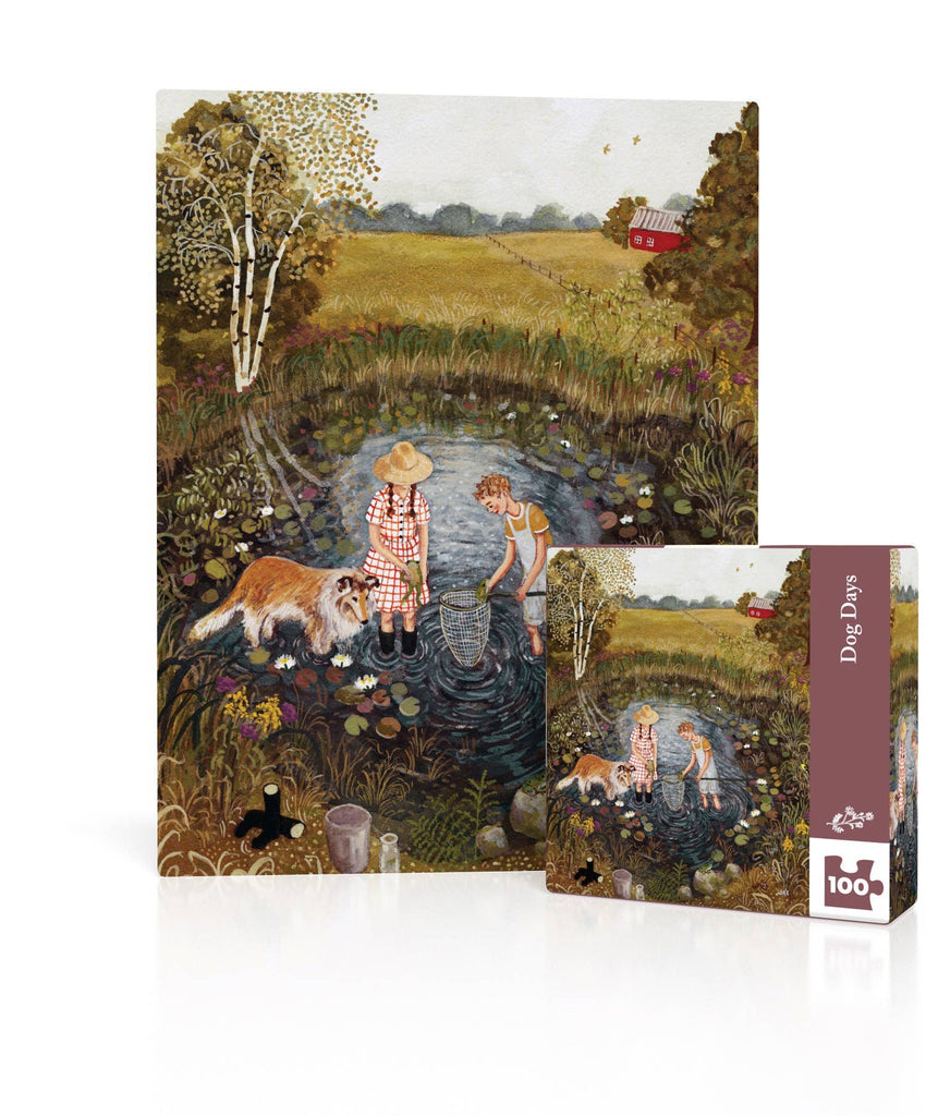 A completed Dog Days Mini - 100 Piece Mini Puzzle and its packaging, featuring a painting of a girl and boy with a dog using a net to explore a lily pad-covered pond in a field.