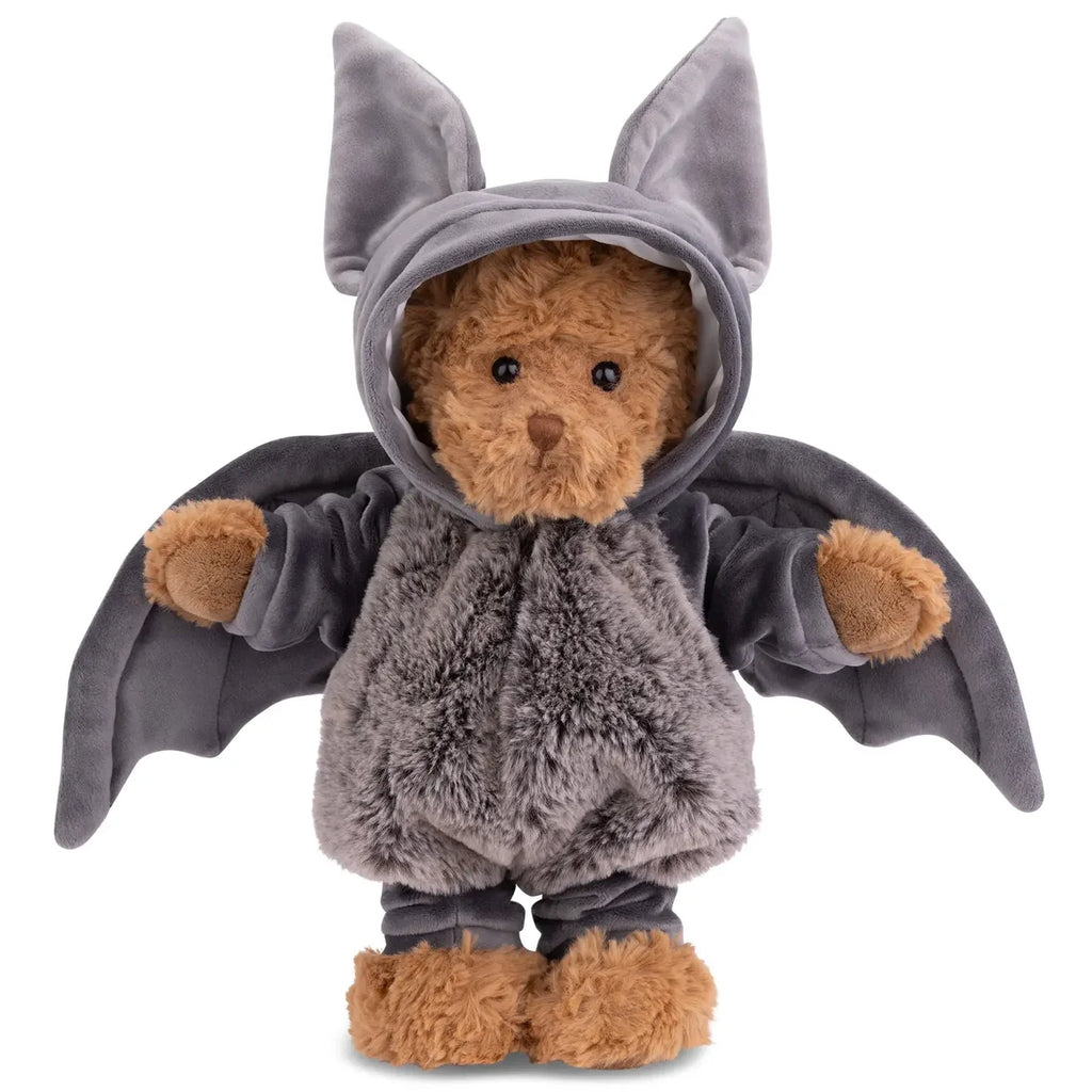 Bukowski - Bear In Bat Costume stands upright against a white background, featuring a charming brown teddy bear dressed in a plush gray bat costume with large wings and tall pointed ears—perfect for cozy nighttime cuddles.