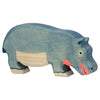 The Holztiger Hippopotamus, Feeding is a handcrafted wooden toy painted in blue and beige with pink accents on its mouth and ear, standing on four legs. Part of the charming HOLZTIGER figures collection, it is made in Europe.