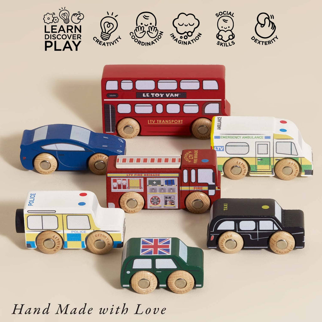 The London Toy Car Set, featuring iconic London vehicles like a double-decker bus, police car, ambulance, and taxi, sits on a beige surface. Icons above showcase its benefits: creativity, dexterity, imagination, social skills, and coordination.
