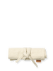 The Ferm Living Ally Pencil Wrap in off-white, crafted from organic cotton with a tan tag, is neatly rolled and tied, shown on a plain white background.