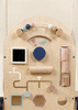 The Wooden Activity Walker is an engaging baby walker featuring beads on a wire, shape sliders, a spinning knob, pastel-colored blocks, and geometric cutouts. Its design encourages sensory exploration and motor skill development for young children, making it a delightful addition to their collection of sensory toys.